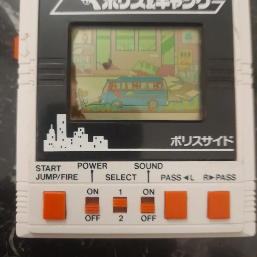 LSI BANDAI ELECTRONICS LCD DOUBLE PLAY POLICE & GANG MADE IN JAPAN 1984
